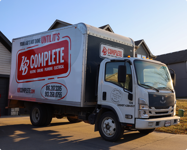 KB Complete box truck parked outside a home on a service call